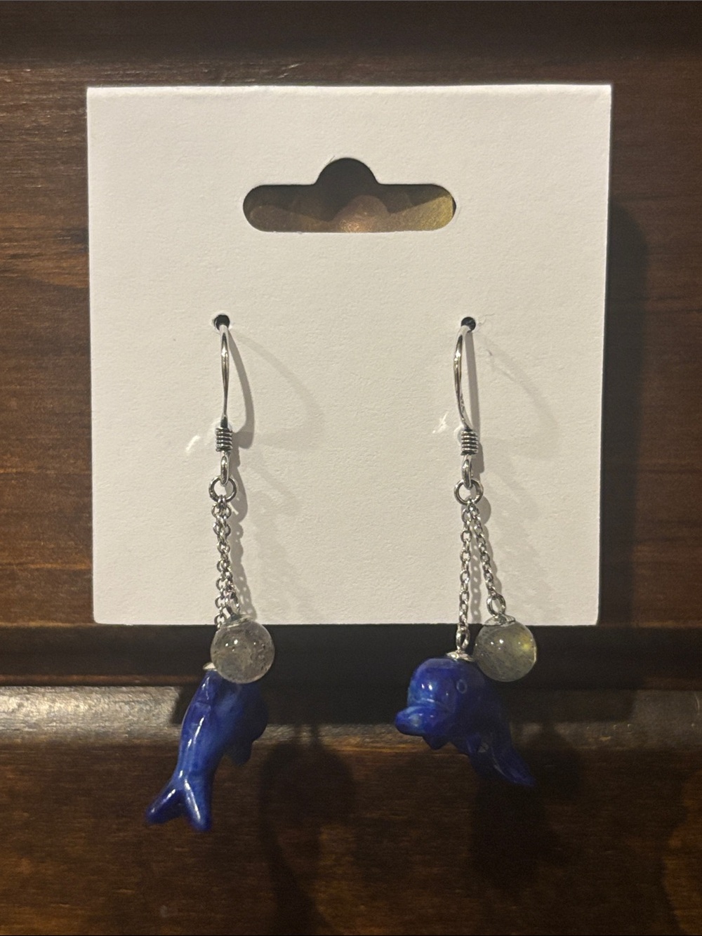 Sterling silver dangle earrings with fish bead